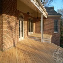 This porch rennovation is completed beautifully with Garapa Porch Decking.