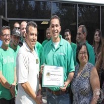 Facility Manager Rick Nevarez receives congratulations from Santa Fe Springs Chamber of Commerce