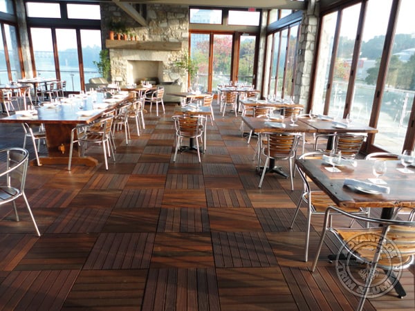 Ipe wood is so hard the chair legs in this dining room will not scratch the surface of our decking tiles.