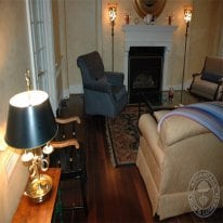 Beautifully decorated room with Black Walnut flooring.