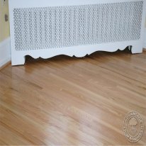 Close-up of oak flooring and chest.