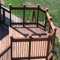 I wanted a multi-elevation deck, so I added a rectangular sitting area at one corner. This is where we have our 3-person swing. The boys and I love sitting out here watching the planes go by.