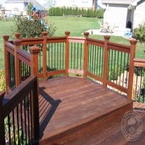 I wanted a multi-elevation deck, so I added a rectangular sitting area at one corner. This is where we have our 3-person swing. The boys and I love sitting out here watching the planes go by.