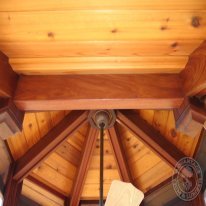 In this picture you can barely see one of the many methods I used to conceal every fastener. These 2x8's were secured between the upper 4x4 posts using pocket-hole joinery. In order to conceal the pocket, I milled 3/8" dowel stock using a router table jig, epoxied in the dowel, and sanded flush.