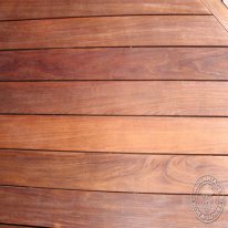 The main deck flooring is laid diagonally, with a picture frame around the whole thing. In order to picture frame, you need double rim joists around your deck. Mine were 2" apart. This gap also served as a "mortise" for the post railing. Each 4x4 railing post received a 2"x2" 7" long tenon on the end. This tenon slips down through the gap in the rim joists and everything is bolted together. The floors was designed to not have a single butt joint. That's why I designed the deck in CAD, so I would know just how many 8' through 20' long 5/4 deck boards I would need to order. All the decking was secured with Ipe clips. Where this was not possible (picture frame and ends), countersunk screws were used and plugged with Ipe.