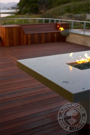 Ipe deck shown at night to highlight the firepits.