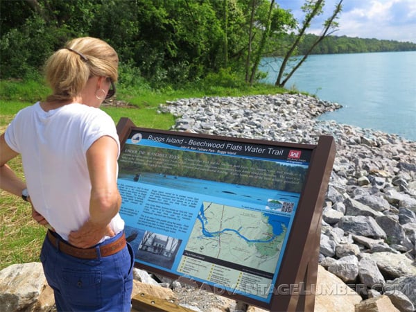 A visitor reading about the special nature of the Buggs Island Kayak Launch in Virginia.