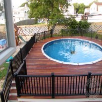 Beautiful Tigerwood deck provides an ideal pool deck surface.