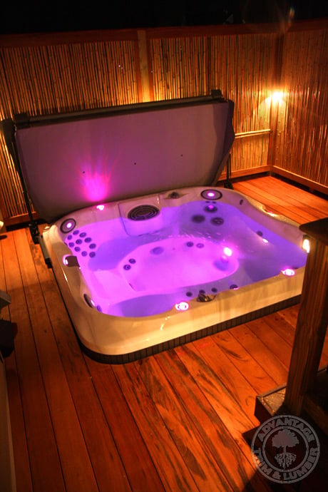 Dramatic lighting in this hot tub combined with Tigerwood Decking creates a one of a kind atmosphere!