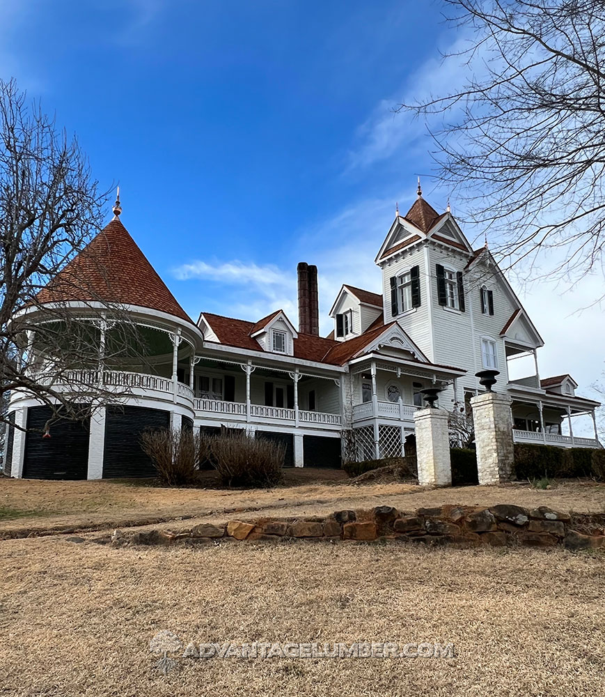 Newly installed wallaba roofing shingles on a farmhouse.
